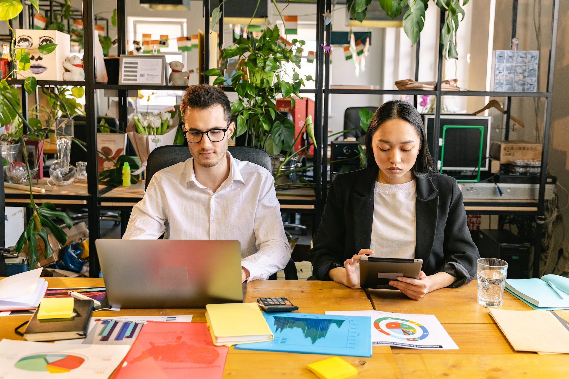 A Man and a Woman Working in the Office A Man and a Woman Working in the Office<br />